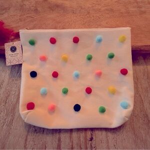 NWT cutest little make-up, catch all bag. Canvas with Pom Poms on the front.